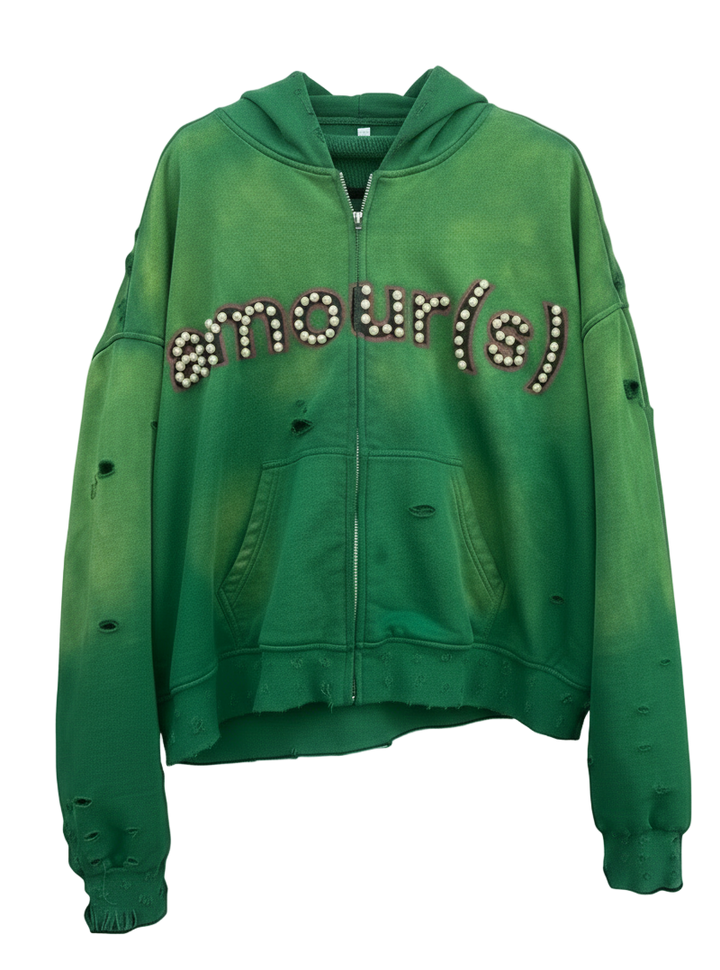 Green hoodie with rhinestone text on a white background